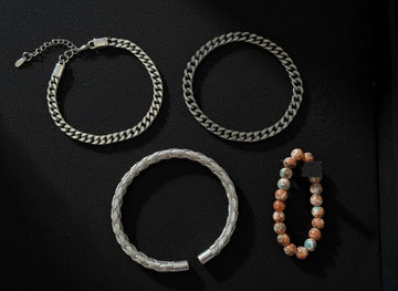 Four bracelets on a black background