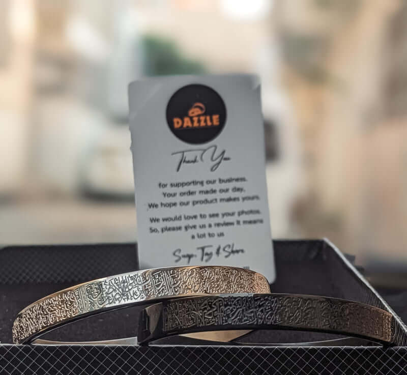 Silver Ayat-ul-Kursi bracelet placed flat – Islamic jewelry showcasing Quranic engraving