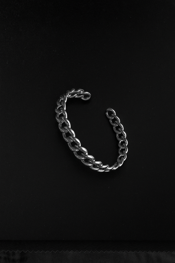 Silver chain bracelet on a black background